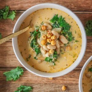 Bowl of bean and kale soup with crispy chickpeas.
