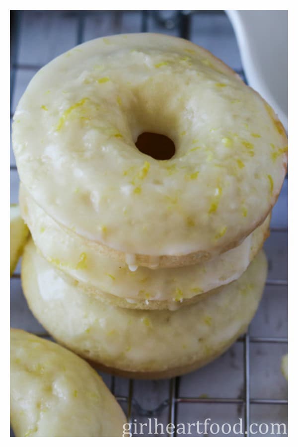 Close-up of a stack of three glazed baked donuts.