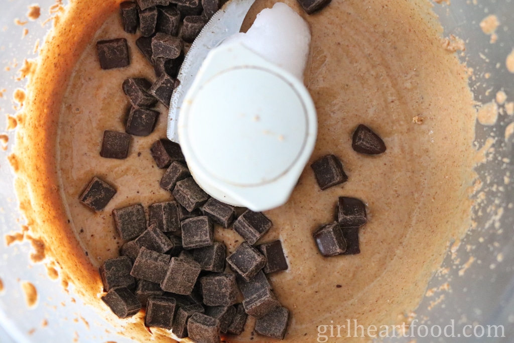 Chocolate chunks and almond butter in a food processor.