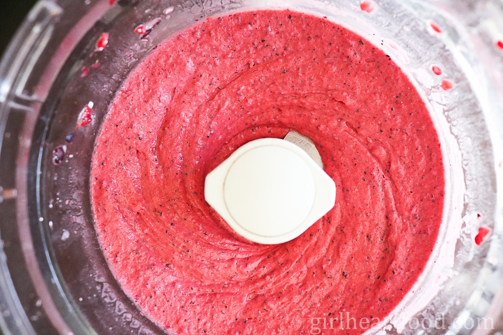 Blended up berry fruit pop mixture in a food processor.