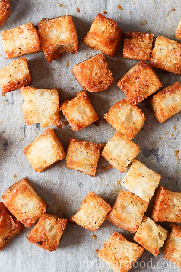 Golden brown homemade croutons after coming out of the oven.