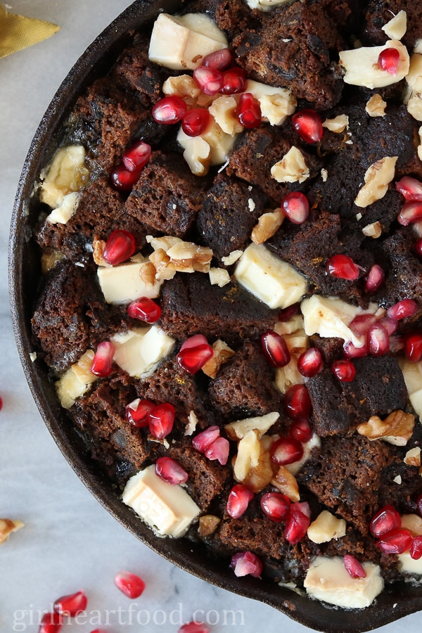 Close-up of fruit cake bread pudding in a skillet.