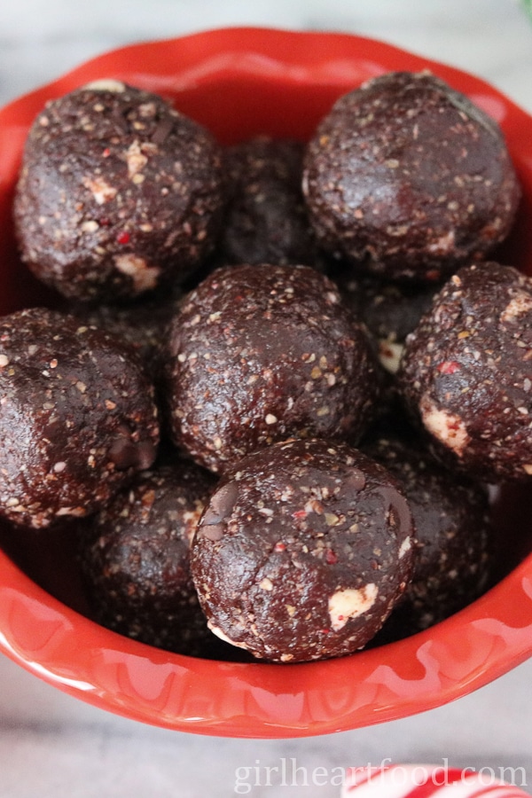 Close-up of peppermint chocolate snack bites in a red dish.