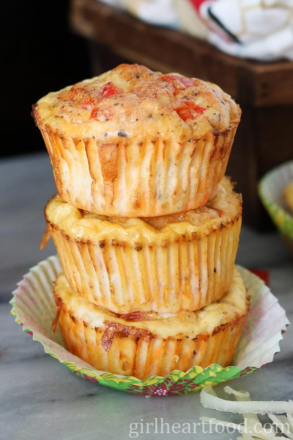 Stack of three breakfast ham and egg muffins.