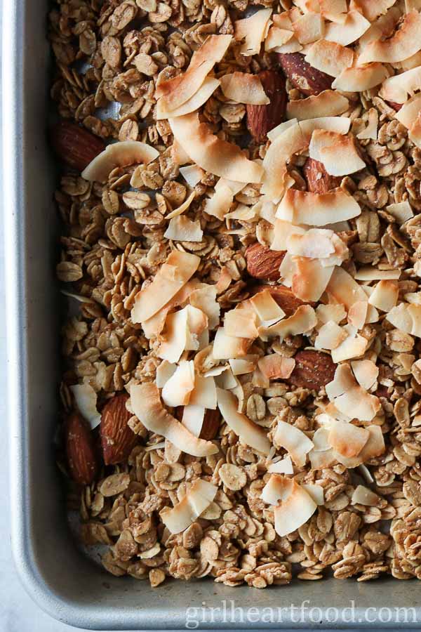 Close-up of homemade granola on a sheet pan.