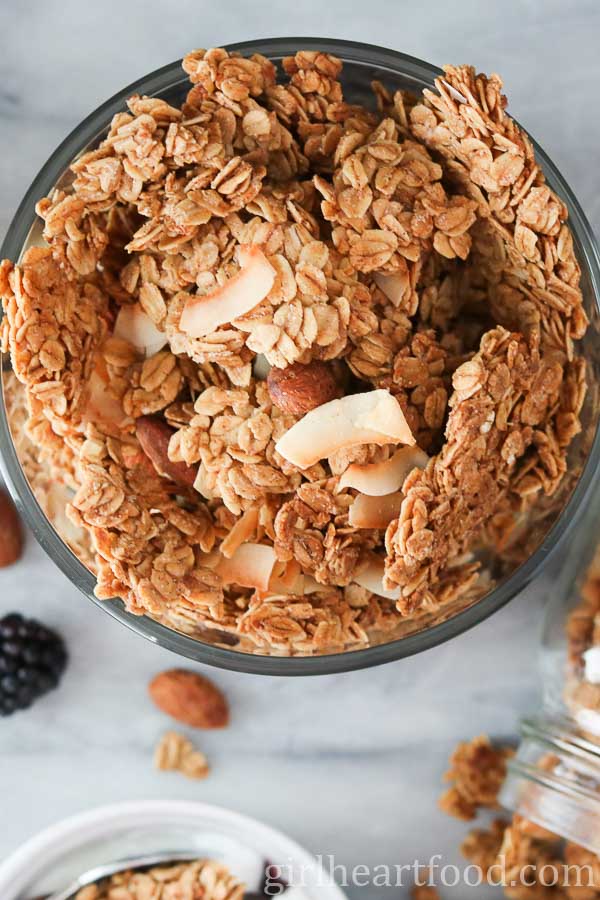 Dish of crunchy clusters of homemade granola.