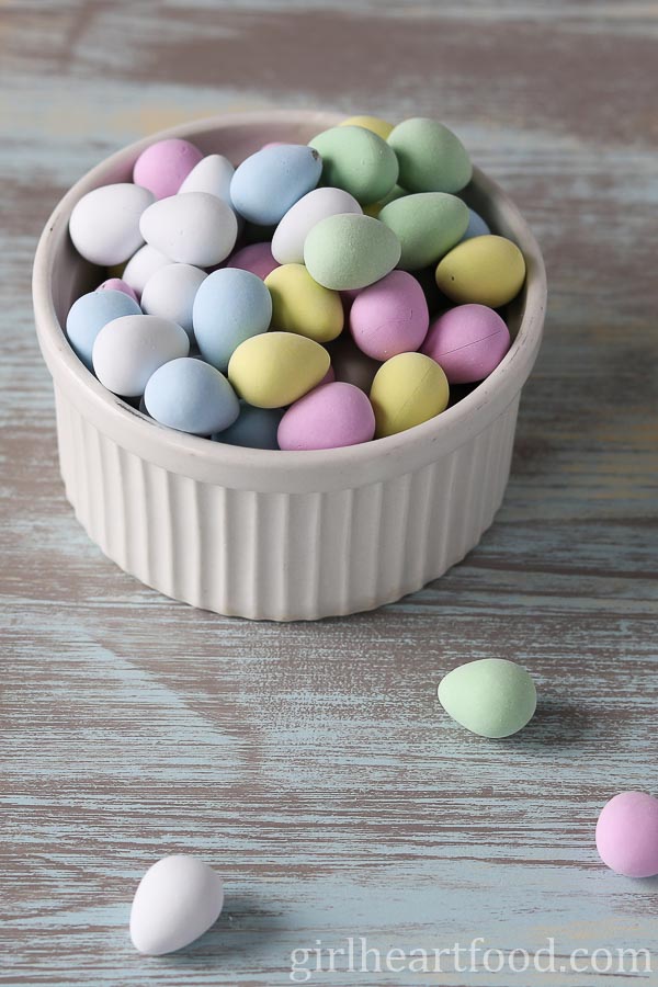 Pastel coloured Easter candy in a white dish.