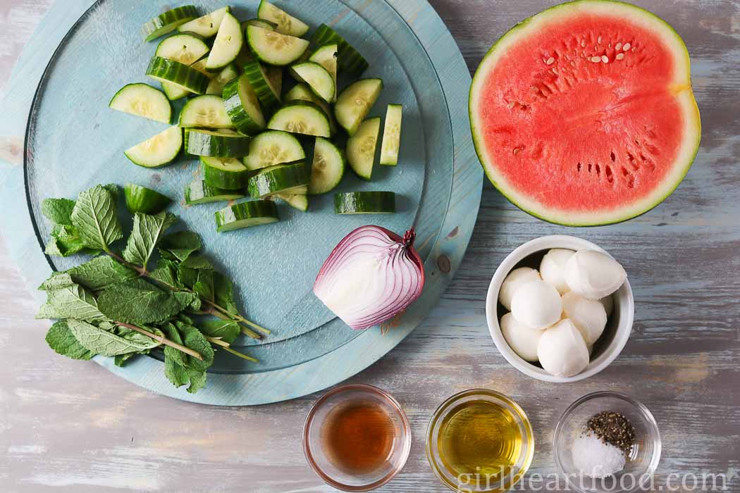 Ingredients for cucumber melon salad with bocconcini.