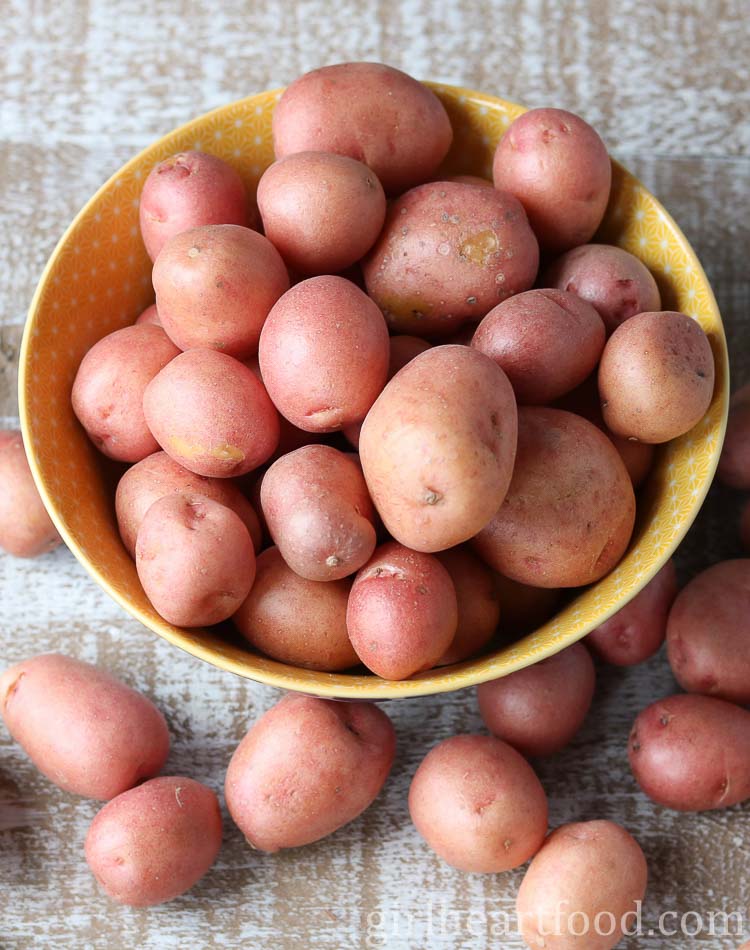 Bowl of uncooked baby red potatoes.
