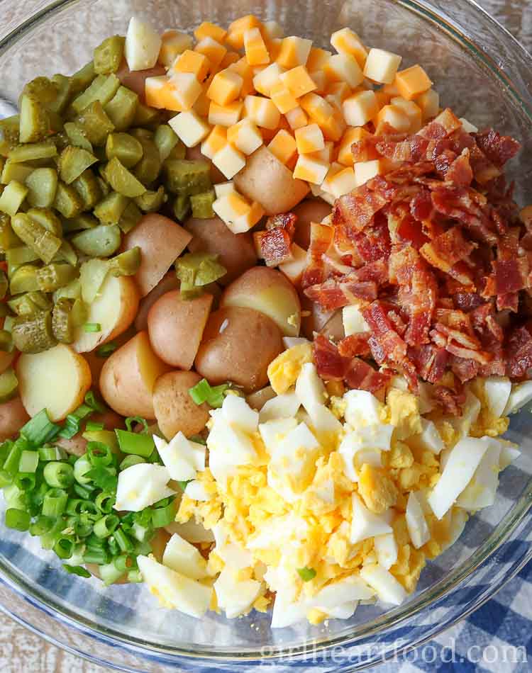 Ingredients for chunky potato salad in a bowl before being mixed together.