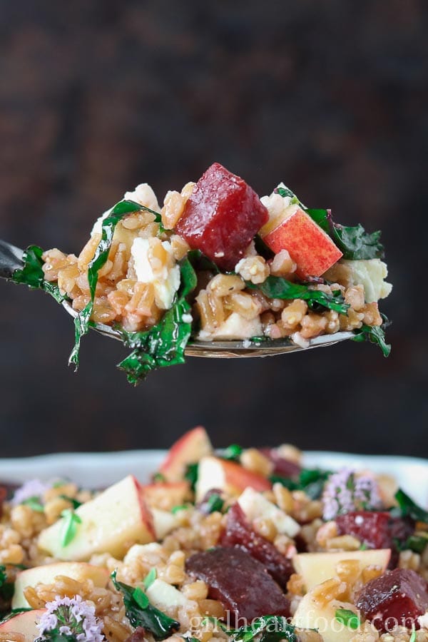Spoonful of farro salad from a dish.