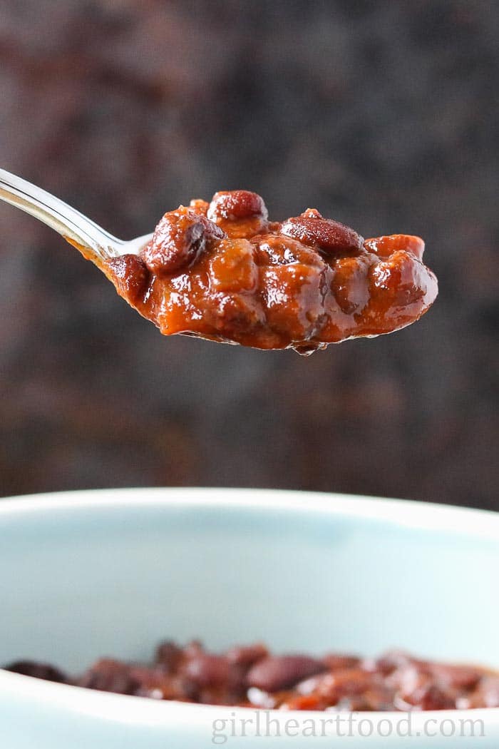 Spoonful of baked black beans.