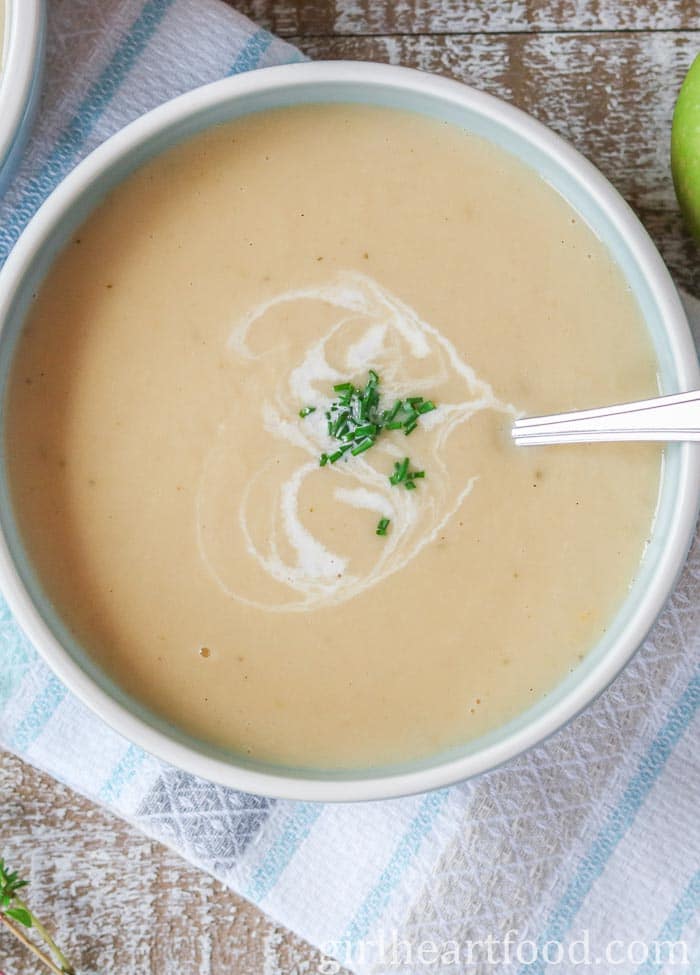 Close-up of a bowl of creamy parsnip apple soup.