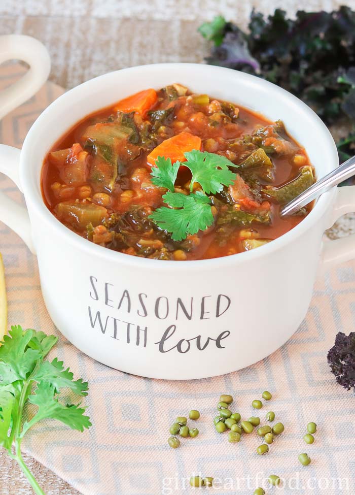 Bowl of mung bean soup garnished with cilantro.