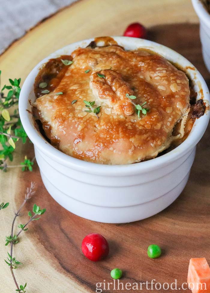 Individual dish of chicken pot pie with puff pastry.