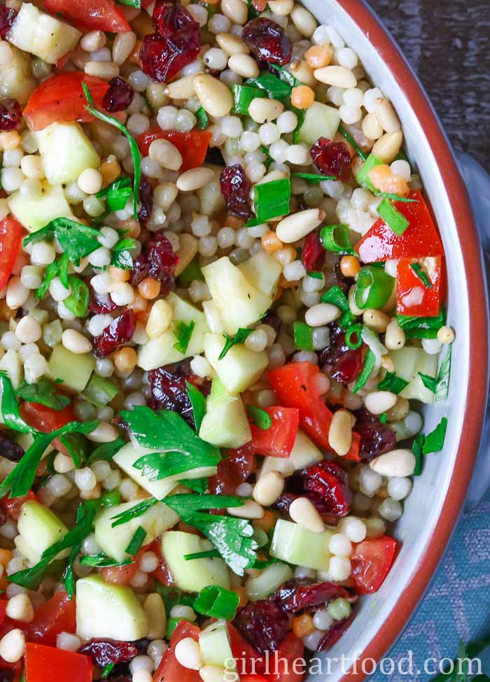 Close-up of pearl couscous salad in a bowl.