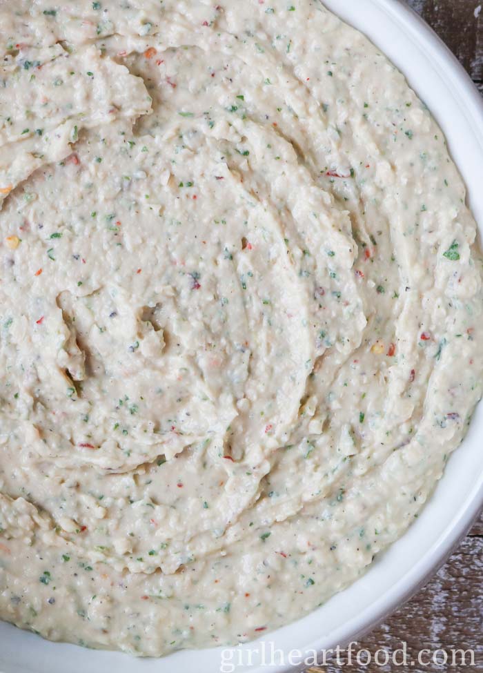 Bowl of ungarnished bean dip.