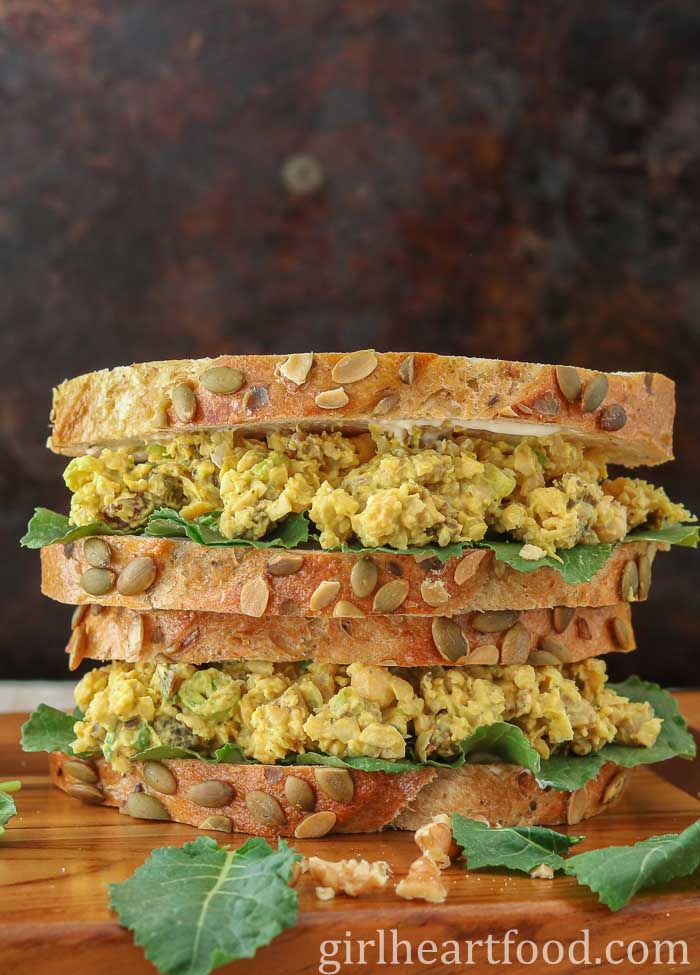 Stack of two curried chickpea salad sandwiches.