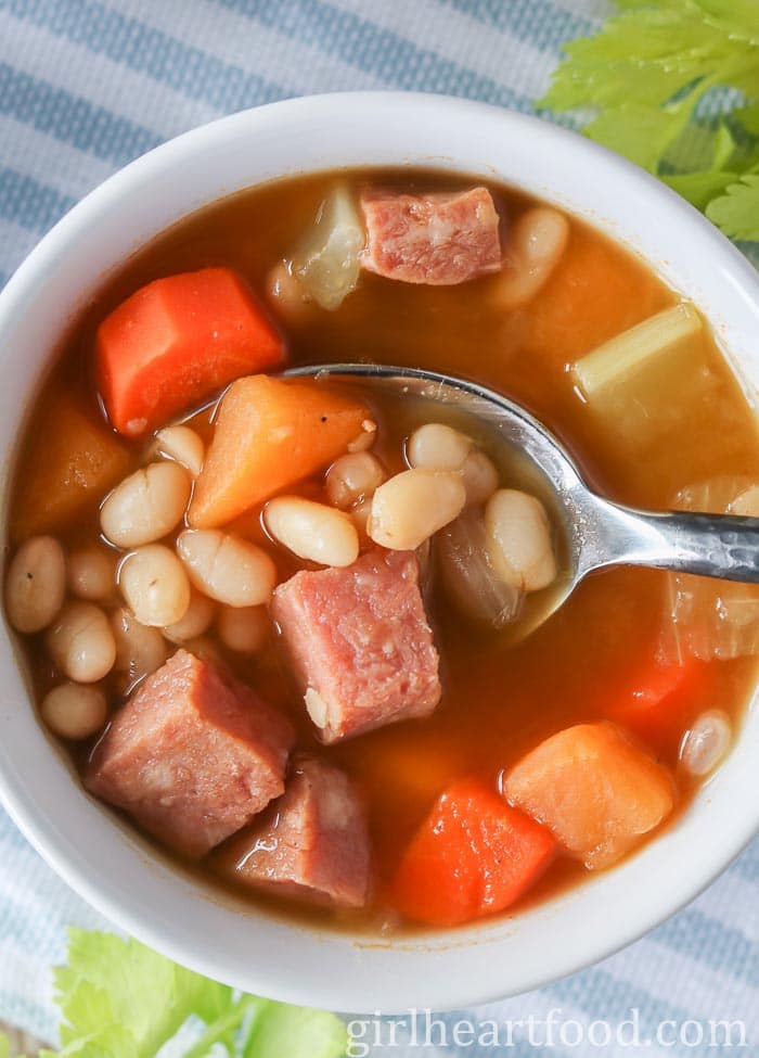 Bowl of Newfoundland boiled beans with a spoon scooping some up.