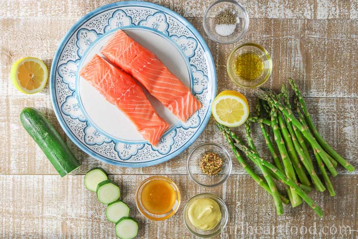 Ingredients for a honey mustard salmon and vegetable recipe.