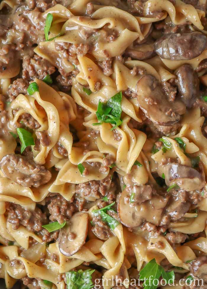Close-up of ground beef stroganoff garnished with parsley.