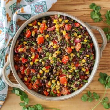 Corn and black bean quinoa salad in a serving dish.