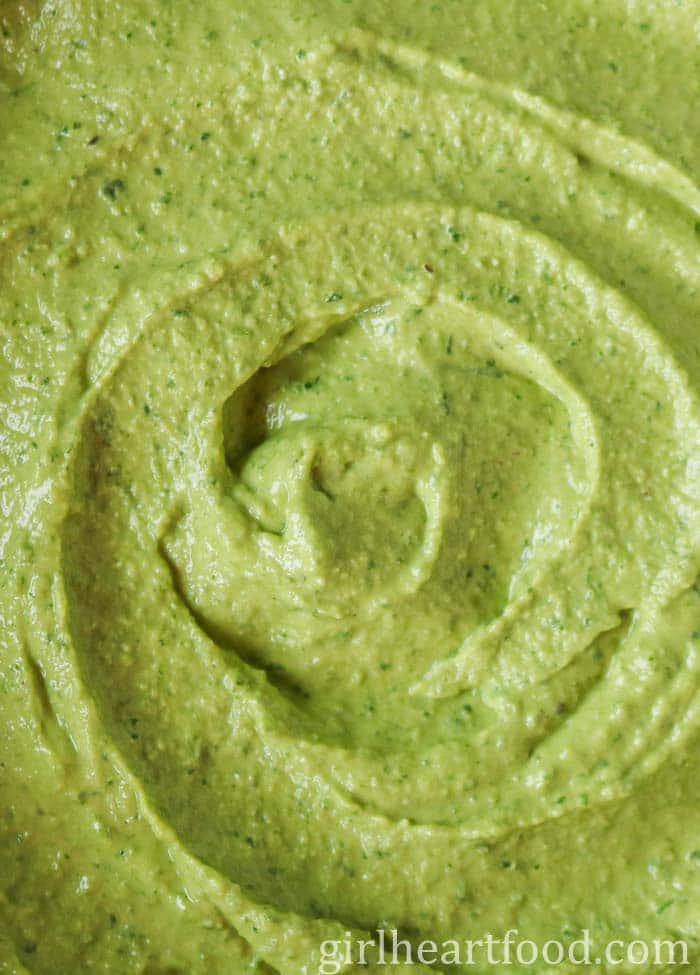 Close-up of a green hummus recipe.