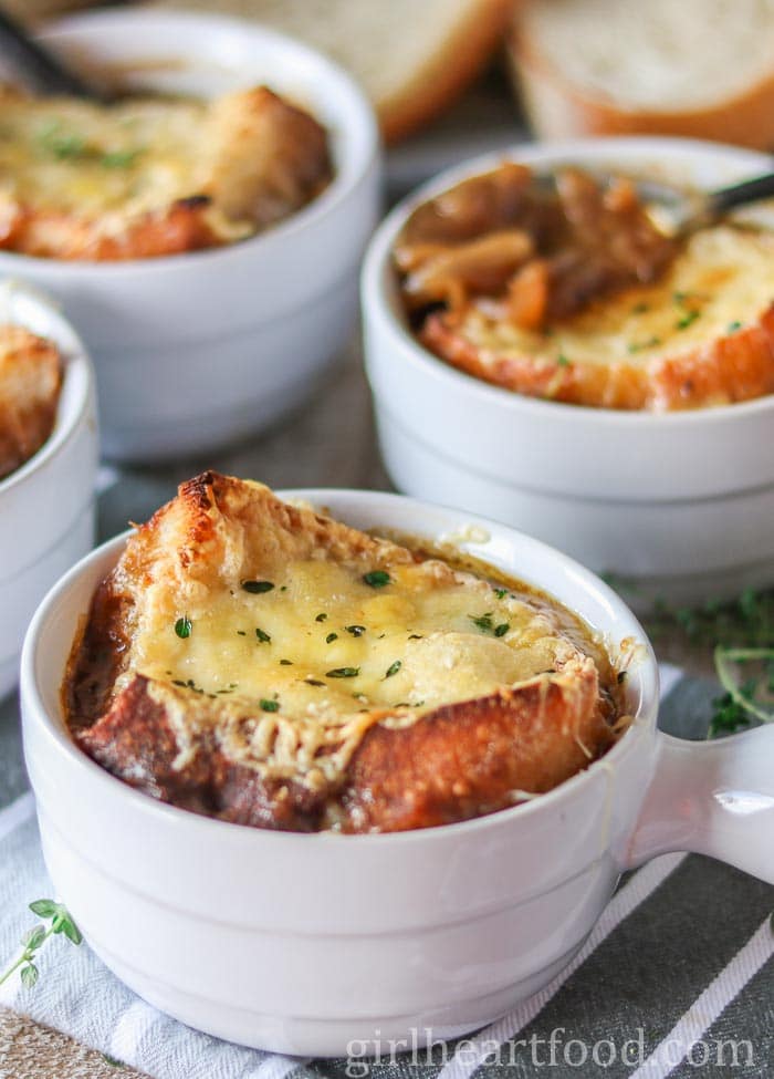 Several bowls of French onion soup.