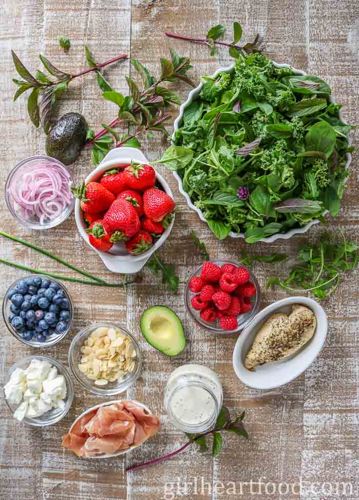 Ingredients for a hearty mixed greens salad recipe.