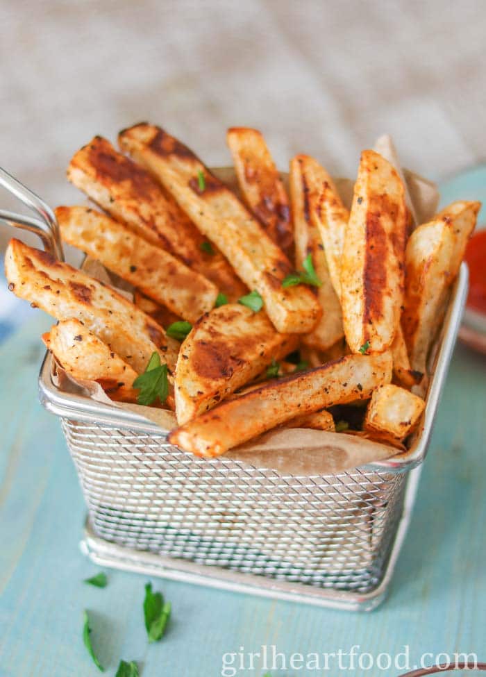 Turnip fries in a steel basket.