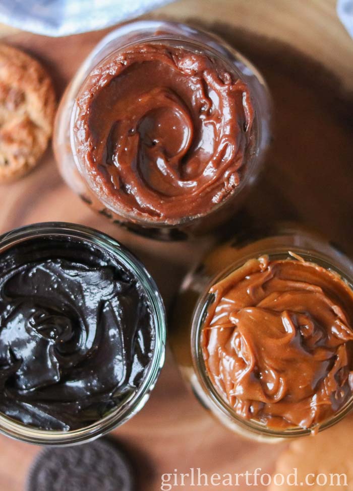 Three jars of homemade cookie butter, each a different flavour.