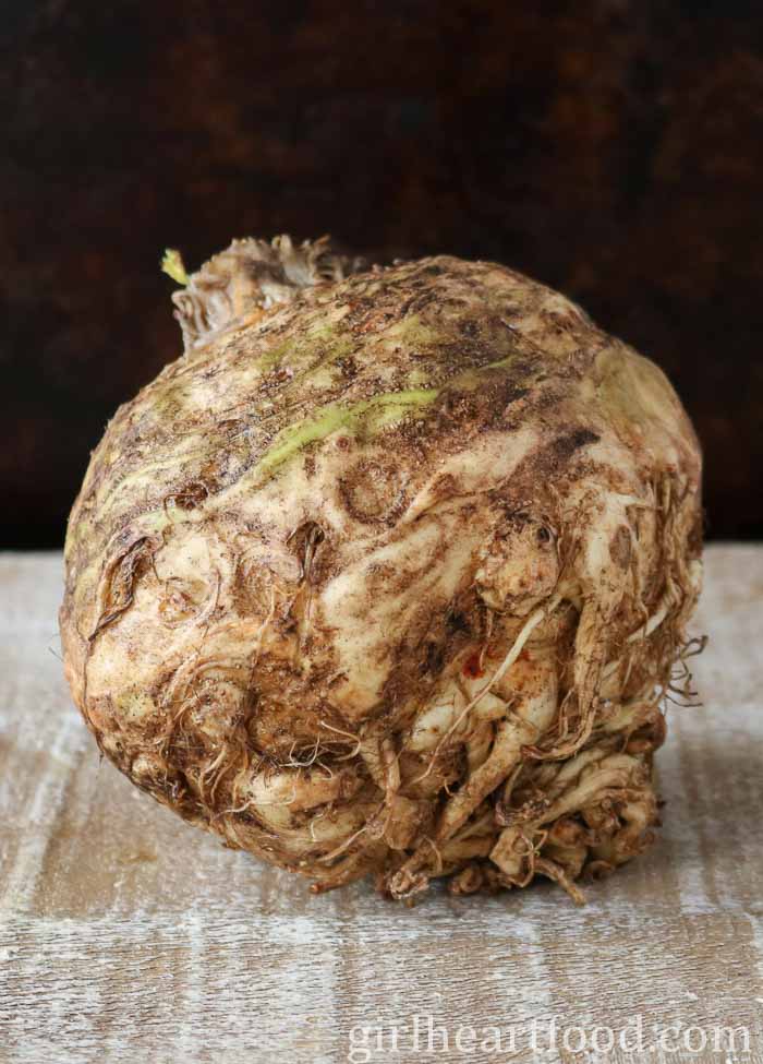 Unpeeled and uncooked bulb of celeriac.