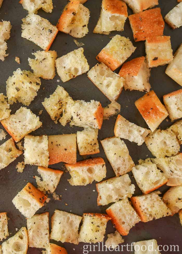 Croutons on a sheet pan before being baked.