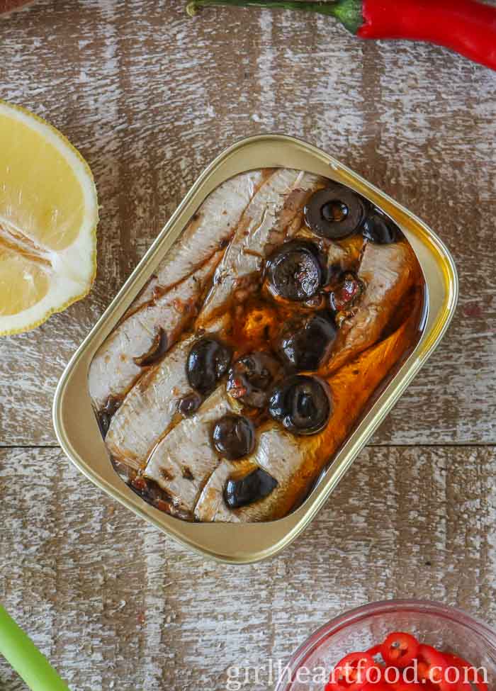 Tinned sardines in oil with olives.