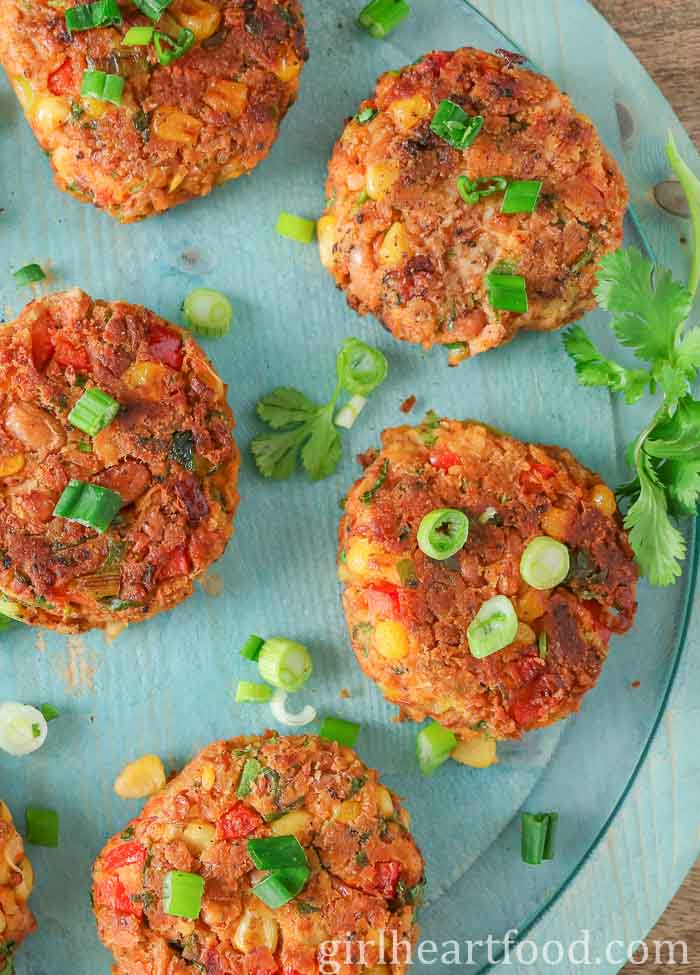 Bean patties garnished with green onion.