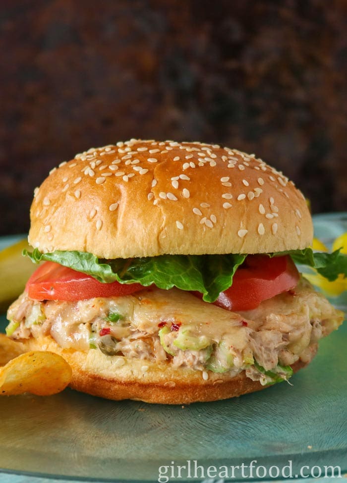 Tuna melt sandwich with lettuce and tomato.