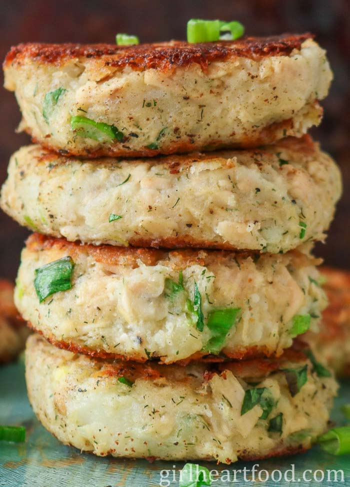 Close-up of a stack of four tuna and potato patties.