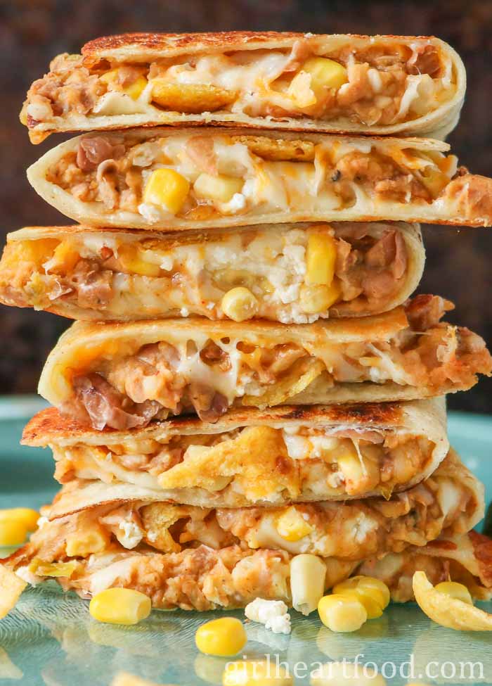 Stack of seven refried bean quesadillas.
