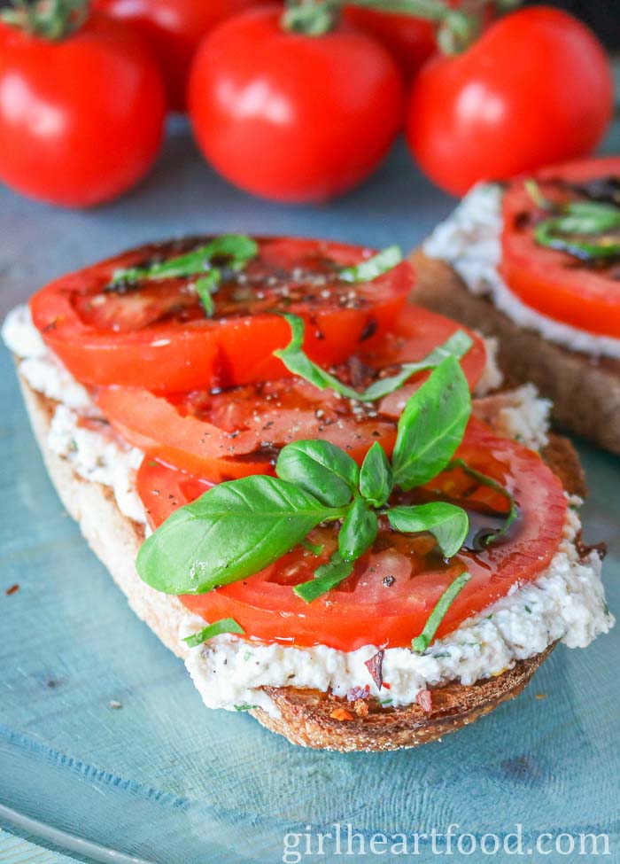Toast with ricotta cheese, tomato, basil and balsamic reduction.