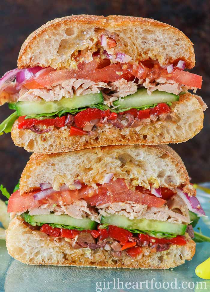 Stack of two halves of a veggie tuna sandwich.