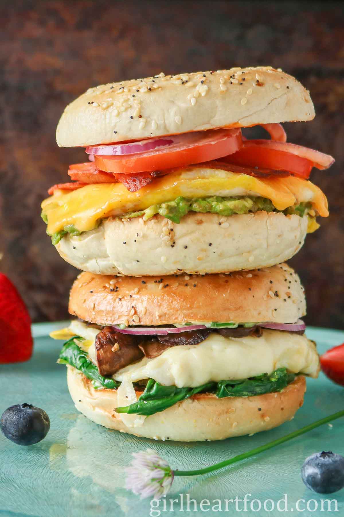 Stack of two bagel breakfast sandwiches.