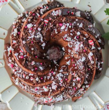 Chocolate peppermint cake with ganache, candy and sprinkles.