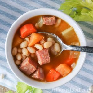 Bowl of Newfoundland boiled beans with a spoon scooping some up.