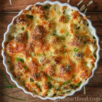 Cheesy baked broccoli and cauliflower in a dish.