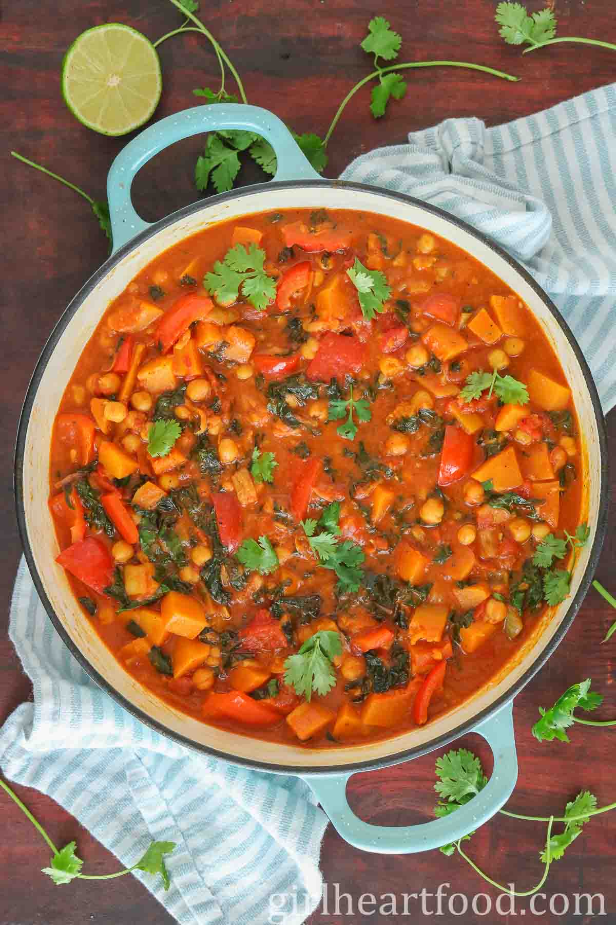 Butternut squash curry in a pan garnished with cilantro.