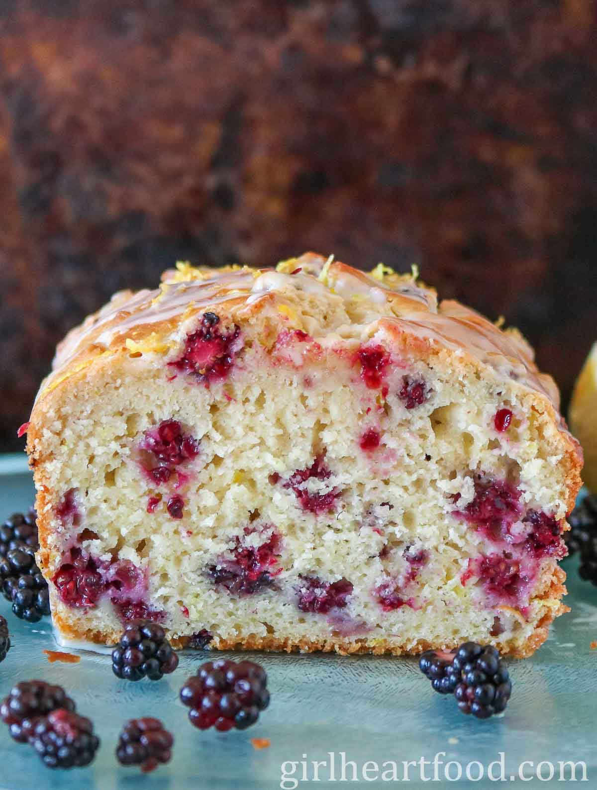 A cut blackberry loaf, showing the interior texture.