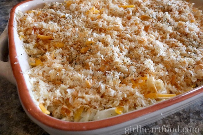 Cod au gratin in a casserole dish before being baked.