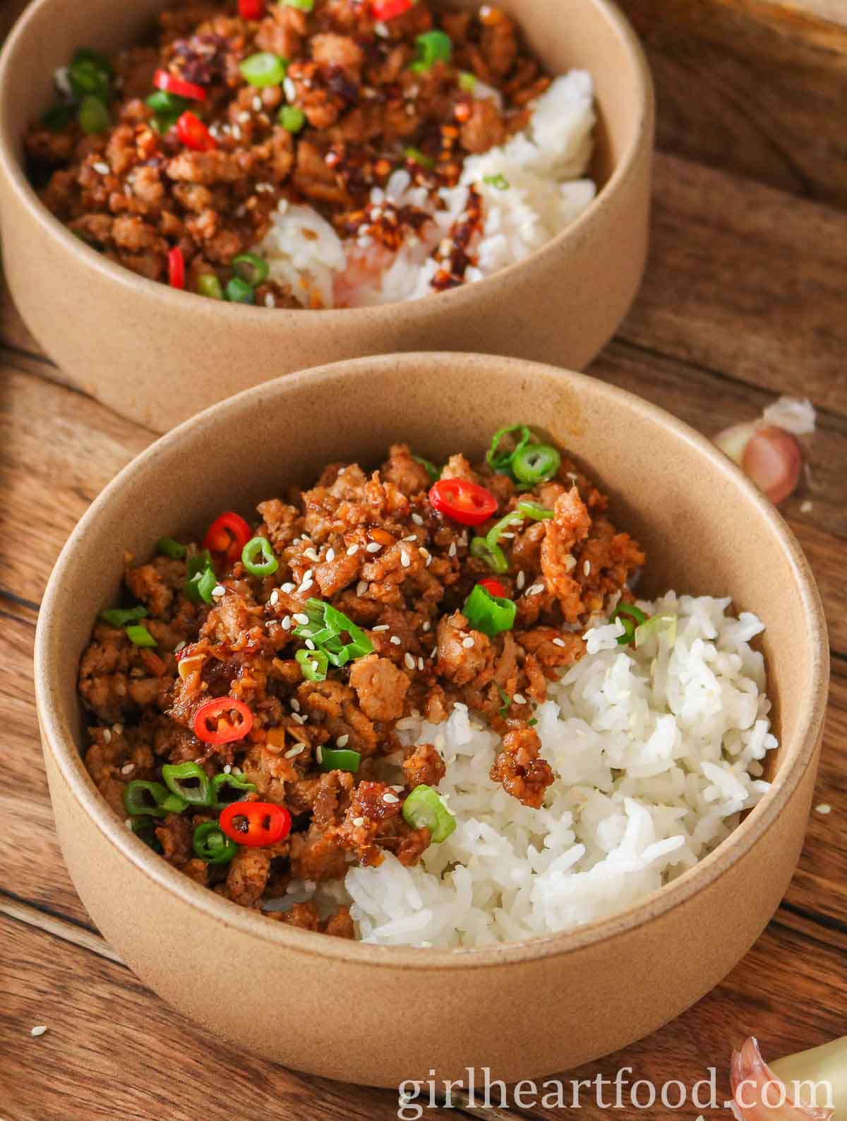 Two ground turkey and rice bowls, one in front of the other.