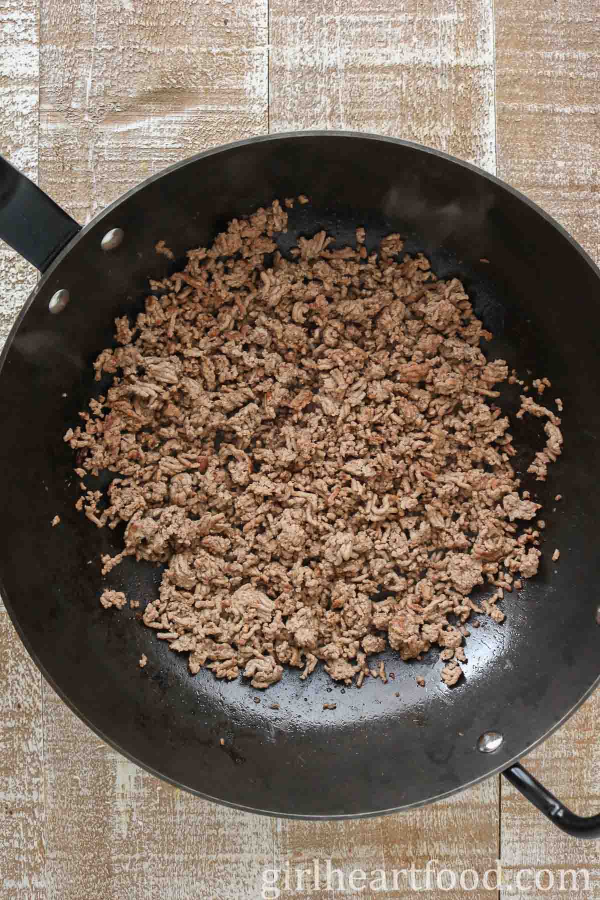 Cooked ground beef in a wok.