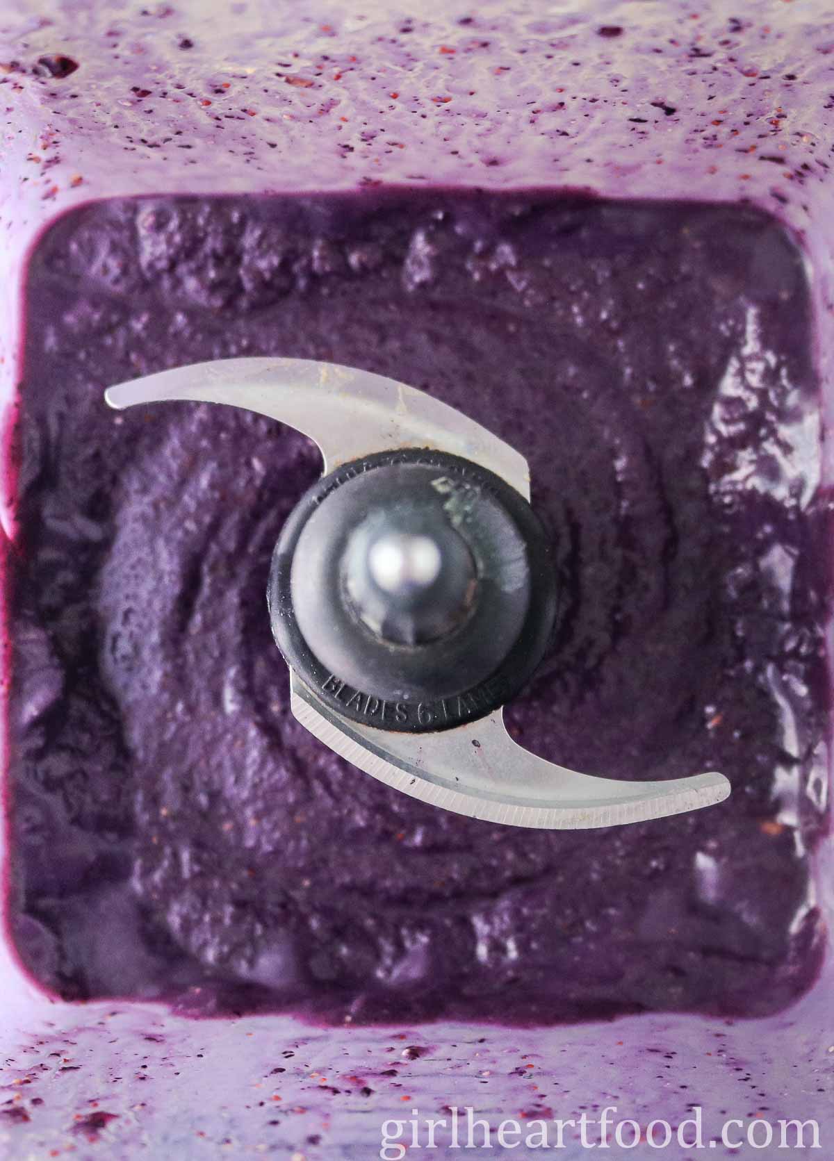 Fruity purple smoothie in a blender.